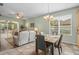 Inviting dining area connects to the living room and features a chandelier at 10290 Cypress Vine Dr, Orlando, FL 32827