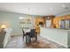 Open dining area connects to the kitchen with lots of space for entertaining guests at 10290 Cypress Vine Dr, Orlando, FL 32827