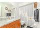 Modern bathroom with granite countertop, stylish shower curtain, and hexagon wall art at 12240 Huntsman Ln, Orlando, FL 32826