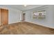 Cozy bedroom featuring neutral walls, carpet flooring and a window for natural light at 124 Cinnamon Dr, Orlando, FL 32825