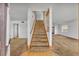 Inviting entryway with a carpeted staircase leading to the second floor and adjacent living area at 124 Cinnamon Dr, Orlando, FL 32825