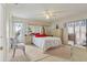 Bright bedroom with large window, comfortable bed, and neutral carpet at 13469 Texas Woods Cir, Orlando, FL 32824