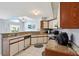 Bright kitchen featuring granite countertops, white cabinets, and natural light at 13469 Texas Woods Cir, Orlando, FL 32824