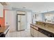 Kitchen with white appliances, stone countertops, and tile flooring at 13469 Texas Woods Cir, Orlando, FL 32824