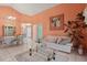 Open-concept living room flowing into a dining area, with neutral walls and tile floors at 13469 Texas Woods Cir, Orlando, FL 32824