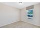 Bedroom featuring carpeted floors, a window, and natural light at 1727 Garden View St, Mascotte, FL 34753