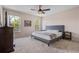 Inviting bedroom with cozy carpeting, large windows, and ample natural light at 176 Blue Jay Way, Davenport, FL 33896