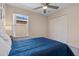 Bedroom featuring a comfortable bed, ample storage, and natural light at 176 Blue Jay Way, Davenport, FL 33896