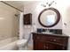 Updated bathroom featuring wood cabinet vanity and a shower with tub combination at 2166 Woodbridge Rd, Longwood, FL 32779