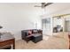 Bedroom with a leather sofa, ceiling fan, and mirrored closet doors at 2166 Woodbridge Rd, Longwood, FL 32779