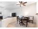 Cozy dining room featuring elegant furnishings, a ceiling fan, and an open layout leading to the living area at 2166 Woodbridge Rd, Longwood, FL 32779