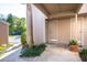 Townhome front entrance with tropical landscaping at 2166 Woodbridge Rd, Longwood, FL 32779