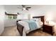 Well-lit main bedroom features a cozy bed, and an open view to the upper floor at 2166 Woodbridge Rd, Longwood, FL 32779