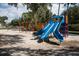 Community playground with colorful slides and climbing structures on a sandy base at 2166 Woodbridge Rd, Longwood, FL 32779