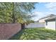 Beautiful backyard with a combination of brick and white fencing surrounding the property, providing privacy at 2168 Continental St, St Cloud, FL 34769