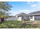 Backyard featuring a playground set, solar panels, white fencing and spacious area to enjoy outdoor activities at 2168 Continental St, St Cloud, FL 34769