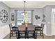 Comfortable dining room featuring a modern table with six cushioned chairs and a stylish chandelier at 2168 Continental St, St Cloud, FL 34769