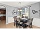 Elegant dining room with modern lighting, wainscoting, and a window for natural light at 2168 Continental St, St Cloud, FL 34769