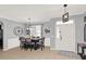 Elegant dining room with modern lighting, wainscoting, and a window for natural light at 2168 Continental St, St Cloud, FL 34769