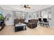 Inviting living room with tiled floors, ceiling fan, and an open layout into the kitchen at 2168 Continental St, St Cloud, FL 34769