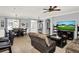 Living room with tile floors, sofa, fireplace, and view of dining room and entrance at 2168 Continental St, St Cloud, FL 34769