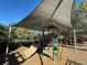 Community playground with slides and climbing equipment under a large sunshade canopy at 2168 Continental St, St Cloud, FL 34769