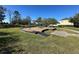 Neighborhood playground featuring a swing set, woodchip base, and manicured lawns for safe recreation at 2168 Continental St, St Cloud, FL 34769