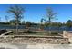 Picturesque pond view with a wooden deck, stone accents, and plenty of birds to watch at 2168 Continental St, St Cloud, FL 34769