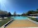 Community swimming pool with clear blue water, lounge chairs, and pergola at 2168 Continental St, St Cloud, FL 34769