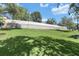 Large, well-maintained backyard with mature trees and a sturdy fence for privacy at 2581 Ponkan Summit Dr, Apopka, FL 32712