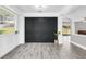 Dining area with a dark accent wall and a view into the sun room at 2581 Ponkan Summit Dr, Apopka, FL 32712