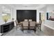 Elegant dining room featuring a dark accent wall and stylish decor at 2581 Ponkan Summit Dr, Apopka, FL 32712