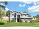 Charming two-story home featuring a well-manicured lawn and neutral gray exterior paint at 2581 Ponkan Summit Dr, Apopka, FL 32712