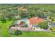 Aerial view showcasing the community pool, clubhouse, and surrounding landscape, offering a glimpse of luxurious living at 2676 Emerald Island Blvd, Kissimmee, FL 34747