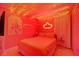 Whimsical bedroom with pink walls, string lights, and a charming, themed decor at 2676 Emerald Island Blvd, Kissimmee, FL 34747