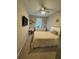 Bedroom with a bed, desk, TV, ceiling fan, and window at 272 Cedar Bark Ln, Sanford, FL 32771