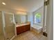 Primary bathroom featuring double vanity, separate shower and tub at 2801 Hardenbergh Ln, Eustis, FL 32726