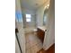 Bathroom featuring tile floors, shower-tub combo, a vanity with a white sink and cabinet storage at 2801 Hardenbergh Ln, Eustis, FL 32726