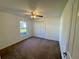 Bedroom featuring carpet floors, a ceiling fan, window and closet storage at 2801 Hardenbergh Ln, Eustis, FL 32726