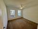 Bright bedroom with carpet, white walls, ceiling fan, and a pair of double hung windows at 2801 Hardenbergh Ln, Eustis, FL 32726