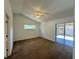 Large bedroom with a vaulted ceiling, ceiling fan and sliding door access to the patio at 2801 Hardenbergh Ln, Eustis, FL 32726