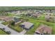 Elevated view displaying the home's roof, lush lawn, and neighboring residences, capturing the community's ambiance at 2851 Stonewood Cir, Lakeland, FL 33810