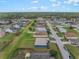 Aerial view of a single-Gathering home, showcasing a spacious backyard and a well-maintained lawn, with a neighborhood view at 2851 Stonewood Cir, Lakeland, FL 33810