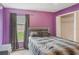 Bedroom with a ceiling fan and a window with dark curtains at 2851 Stonewood Cir, Lakeland, FL 33810