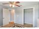 This is a bedroom with a closet, doorway, ceiling fan, and light gray walls at 2851 Stonewood Cir, Lakeland, FL 33810