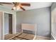 Neutral bedroom features a ceiling fan and closet with an unfinished bed frame at 2851 Stonewood Cir, Lakeland, FL 33810