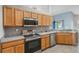 A kitchen with stainless steel appliances and wooden cabinets at 2851 Stonewood Cir, Lakeland, FL 33810