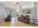 Living room featuring stylish leather seating and view to kitchen, dinette, and backyard at 2851 Stonewood Cir, Lakeland, FL 33810