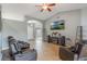 Cozy living room with tile floors, vaulted ceilings, and comfortable leather seating at 2851 Stonewood Cir, Lakeland, FL 33810