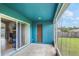 Enclosed porch with access to house and backyard; with view of a wooded privacy fence at 2851 Stonewood Cir, Lakeland, FL 33810